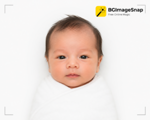 Alt Text: Professional baby passport photo taken with studio-quality lighting on a plain white background